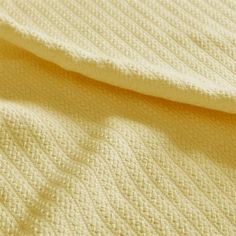 the textured fabric is soft and light yellow