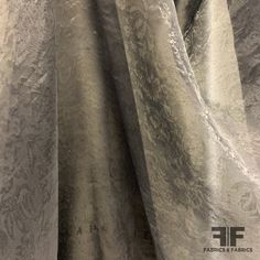 This stunning organza is a black color. Unique for the gorgeous and subtle floral jacquard pattern and day-to-night wearability, this organza is a popular choice for chic dresses, skirts, and blouses . This fabric is sheer, therefore a lining is needed if additional structure and modesty is desired. SKU: 6717 Content: 100% Silk Color: Black Width: 56 inches Origin: Italy Elegant Brocade Fabric For Party, Elegant Jacquard Fabric For Evening, Elegant Organza Fabric For Party, Elegant Jacquard Fabric For Wedding, Elegant Brocade Fabric For Formal Occasions, Skirts And Blouses, Floral Jacquard, Jacquard Pattern, Chic Dresses