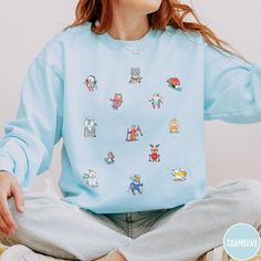 Get ready to hit the slopes in adorable style with our Skiing Comfort Colors Sweatshirt! This winter wonder showcases cute little animals hitting the slopes, adding a whimsical touch to your skiing adventures. Made from soft and cozy fabric, this sweatshirt is perfect for showcasing your love for both winter sports and charming critters. Embrace the snowy vibes with our playful and stylish Skiing Comfort Colors Sweatshirt - where cute meets comfort on the slopes! Luxurious comfort and style are what this unisex, garment-dyed sweatshirt is all about. It's made with 80% ring-spun cotton and 20% polyester and the fabric is 3-end garment-dyed, ring-spun, color-blast fleece with a 100% cotton face. Each sweatshirt comes with a relaxed fit, a rolled-forward shoulder, and a back neck patch.  .: 8 Sporty Crew Neck Hoodie With Cartoon Print, Sporty Hoodie With Cartoon Print And Crew Neck, Playful Winter Crew Neck Sweatshirt, Playful Crew Neck Hoodie For Winter, Playful Crew Neck Winter Sweatshirt, Sporty Winter Sweatshirt With Cartoon Print, Sporty Sweatshirt With Cartoon Print For Winter, Winter Fun Relaxed Fit Tops, Fun Winter Tops With Relaxed Fit