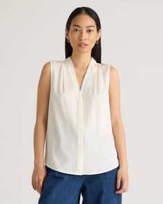 Our popular stretch silk blouse but now sleeveless. It's a classic, versatile look with a bit of stretch for a more forgiving fit and additional versatility. Perfect for work meetings, or stepping out to brunch. Plus, silk fiber contains 18 kinds of amino acids that make it amazing for skin nourishment, hypo-allergenic, and naturally thermoregulating to help maintain body temperature.  | Quince | Women's 100% Washable Silk Stretch Sleeveless Blouse in Ivory, Size Medium Sleeveless Silk Blouse, Work Meetings, Silk Fiber, Work Meeting, Body Temperature, Woven Top, Mulberry Silk, Quince, Amino Acids