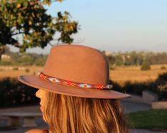 Dress up any hat with this western beaded leather hat band. Beautiful native and Navajo patterns with vibrant colors. Bring a southern charm to your old favorites with this gorgeous hat band or make your new hat even more special. Made of full grain leather (highest grade leather) and glass beads. Handmade in Brazil by artisan women. You can match your hat band with our best-selling leather beaded dog collars! Treated with beeswax, water resistant. 30 days free returns or exchange. 1-year warran Red Beaded Festival Hat, Handmade Bohemian Red Hat Bands, Handmade Red Bohemian Hat Bands, Handmade Red Hat Bands For Rodeo, Bohemian Beaded Hat Bands For Rodeo, Bohemian Red Hat Bands For Festival, Red Bohemian Hat Bands For Festivals, Bohemian Festival Hat Bands In Red, Bohemian Festival Red Hat Bands