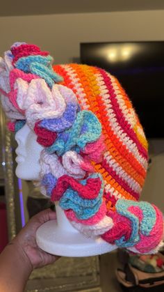 there is a crocheted hat on top of a mannequin's head