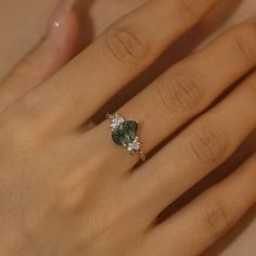 Magical, otherworldly, enchanting. Our Enchanted Garden Pear Moss Agate Ring© has earned its name with a stunning pear-shaped moss agate center stone adorned with clusters of round moissanite gems in a twisted band. May this piece allow you to spread the seeds of happiness and cultivate a life you love. ✦ Available in 10K/14K Solid White, Yellow, and Rose Gold Pear Moss, Oval Moissanite Ring, Pear Shaped Ring, Moss Agate Ring, Victorian Lace, Twisted Band, Enchanted Garden, Round Moissanite, Agate Ring