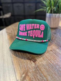 SAVE WATER DRINK TEQUILA 5 Panel high crown OTTO trucker style hat with mesh back panels and an adjustable snap back. (As shown: Kelly Green with Neon Pink Glitter and Custom Name Charm). Green Trucker Hat For Beach, Green Trucker Hat For The Beach, Adjustable Green Trucker Hat For Summer, Summer Green Flat Bill Trucker Hat, Green Flat Bill Trucker Hat For Beach, Fun Snapback Hat With Flat Bill And Adjustable Fit, Adjustable Baseball Cap Trucker Hat For Festivals, Adjustable Trucker Baseball Cap For Festival, Fun Adjustable Snapback Hat With Flat Bill