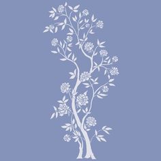 a white tree with flowers on a blue background