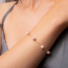 Complete your bridal look with the timeless elegance of pink pearl bracelets. These exquisite accessories add a touch of sophistication and grace to any bride's ensemble. The lustrous pearls delicately embrace your wrist, symbolizing purity and beauty on your special day. Whether you prefer a dainty pearl bracelet or a statement piece, let the enchanting allure of pink pearls enhance your bridal glow. Radiate elegance as you walk down the aisle, creating memories that will be cherished forever. ☆ Back to my store for more options: https://www.etsy.com/shop/aceelegance ☆ All the pieces you purchased from AceElegance come with a Certificate of Authenticity(925 Sterling Silver, 14k Solid Gold) ☆ www.aceelegance.com ☆ ► Pink Pearl Bracelet * Pearl Diameter: 3 mm / 0.11 inch * Material: High Qu Pink Pearl Bracelet For Wedding, Delicate Pink Bracelets For Wedding, Feminine Pearl Charm Wedding Bracelets, Feminine Pearl Charm Bracelets For Wedding, Delicate Pink Bracelet For Wedding, Delicate Pink Pearl Bracelet For Wedding, Feminine Rose Gold Bracelets For Wedding, Elegant Pink Pearl Bracelet, Pink Pearl Charm Jewelry For Wedding