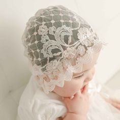 Handmade in the USA The Joli Sheer Lace Bonnet is a contemporary design to pair with her Joli Christening Gown or Joli Romper Dress. Made with a beautiful pink & antique white floral embroidered lace (same lace as dress and gown). Blush pink Venice lace adorns the edges of the bonnet helping to create a delicate ruffle to fame her face. Silk ribbon ties create a perfect fit. Soft pink & antique white embroidered netting Light pink lace Silk ribbon ties White Lace Dress With Lace Bodice For Ceremonies, First Communion Lace Dress With Lace Patchwork, Lace Patchwork Dress For Baptism, White Lace Dress For Baptism In Spring, White Lace Dress For Spring Baptism, First Communion Scalloped Lace Dress, Spring Ceremony Lace Dress, Spring Lace Dress For First Communion, Spring Lace Dress For Baptism