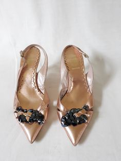 "Vintage italian rose/light pink gold color women slingback shoes/sandals with frontal decorative buttons - black shiny beads. Leather glamour summer stiletto EU size 37 shoes. Made in Italy footwear. European quality. Trendy summer shoes. Made in Italy. Brand: Barbara Bucci condition: normal condition. Some scratches on the left shoe heels, photo No.. Inside sides lining has scratches. Heels height 7,5 cm / 2.9\" in approx. outsole length- 26 cm / 10.1\"in size: EU 37 - labeled size, US 6.5" Designer Embellished Patent Leather Sandals, Embellished Patent Leather Open Toe Sandals, Elegant Embellished Sandals In Patent Leather, Gold Embellished Slingback Pumps For Evening, Gold Embellished Slingback Pumps For Formal Occasions, Glamorous Embellished Gold Slingback Pumps, Glamorous Gold Embellished Slingback Pumps, Gold Patent Leather Sandals For Party, Gold Pointed Toe Slingback Sandals For Party