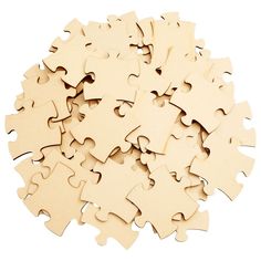 a pile of wooden puzzle pieces sitting on top of each other