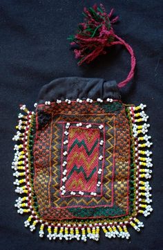 This is a beautiful silk embroidered Uzbek pouch.  It has glass beads all around the edges.  The inner lining is in a cotton material.  The workmanship is exquisite.    -Silk embroidery-Glass beads Luxury Embroidered Art Silk Fabric With Zari Weaving, Traditional Beaded Rectangular Pouch, Multicolor Embroidered Pouch For Festivals, Bohemian Embroidered Pouch For Festivals, Traditional Embroidered Pouch For Festivals, Traditional Pouch With Intricate Embroidery For Festivals, Traditional Festival Pouch With Intricate Embroidery, Traditional Handmade Multicolor Embroidered Pouch, Traditional Handmade Pouch With Multicolor Embroidery