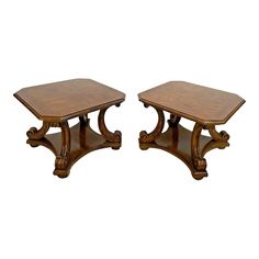 a pair of wooden tables sitting next to each other on top of a white background