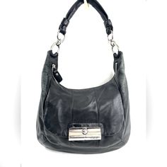 Who Doesn't Luv A Leather Bag You Can Use Everyday And Look Great Doing It? This Coach Kristin 16808 Black Leather Shoulder Bag Will Look Great With Most Of Your Wardrobe. The Front Has A Gusseted Pocket With A Latched Flap And Inside Is A Zipped Pocket And 2 Slip Pockets. Very Good Condition. Minimal Normal Wear. Lots Of Spots Around Inside. No Long Strap. This Is A Pre-Owned Item And May Have Fading Or Discoloration, Marks Or Stains, Scratches, Wrinkling, Wear On Straps, Trim And Texture. If T Coach Kristin Bag, Business Hobo Bag With Metal Hardware, Formal Hobo Shoulder Bag With Gunmetal Hardware, Formal Hobo Bag With Gunmetal Hardware, Classic Black Hobo Bag With Metal Hardware, Formal Black Hobo Bag With Metal Hardware, Coach Rectangular Shoulder Bag With Gunmetal Hardware, Coach Shoulder Bag With Gunmetal Hardware For Business, Coach Business Shoulder Bag With Branded Hardware