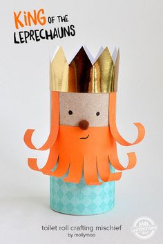 a paper crown with an orange beard and mustache