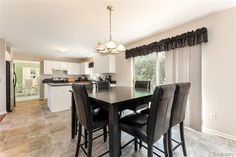 a kitchen and dining room area in a home