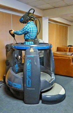 a man riding on top of an inflatable vehicle inside of a living room