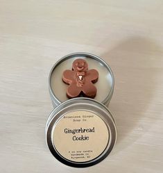 a gingerbread cookie in a tin sitting on a table