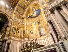 the interior of an ornate church with gold and white paint on it's walls