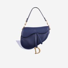 The cherished and emblematic Saddle Bag from Dior makes a surprising comeback in 2018. Reinvented in two different sizes and more colours than ever before, the Classic Dior Saddle Bag in white has now landed at bagsalora. Bursting with class and flair, the Dior Saddle Bag is great for adding the finishing touch to your outfit. SPL Exterior   Navy Calfskin GHW   Gold toned hardware Hanging D charm Top handle design Stud closure Great condition - some minor scratches to exterior    Interior   Textile lining Single storage compartment Zip pocket Excellent condition - some small marks  Sold with dustbag and card   SPL  Height 20.5cm Width 25.5cm Depth 6.5cm Classic Dior, Dream Wishlist, Interior Textile, Interior Textiles, Dior Saddle, Bottega Veneta Shoulder Bag, Rose Gold Hardware, Navy Leather, Handle Design