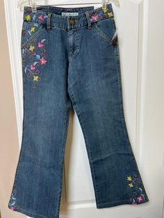 Tommy Hilfiger Denim Bottoms, Spring Embroidered Denim Blue Flare Jeans, Casual Embroidered Denim Blue Flare Jeans, Casual Embroidered Flare Jeans In Denim Blue, Embroidered Blue Flare Jeans For Spring, Spring Embroidered Cotton Flare Jeans, Blue Embroidered Flare Jeans For Spring, Tommy Hilfiger Denim Bottoms For Spring, Casual Embroidered Cotton Flare Jeans