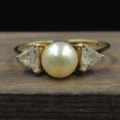 Size 7 10k Gold Pearl With Cubic Zirconia Accents Band Ring Vintage Estate Wedding Engagement Anniversary Gift Idea Beautiful Elegant Unique Classic Gold Pearl Ring With Gemstone, Classic Pearl Ring In Diamond White With Cubic Zirconia, Classic Pearl Ring With Diamond White Cubic Zirconia, Classic Yellow Gold Pearl Ring With Cubic Zirconia, Classic Pearl Ring With Brilliant Cut Cubic Zirconia, Classic Diamond White Pearl Ring With Cubic Zirconia, Classic Pearl Ring With Cubic Zirconia Center Stone, Fine Jewelry Yellow Gold Ring With Cubic Zirconia, Fine Jewelry Yellow Gold Cubic Zirconia Pearl Ring