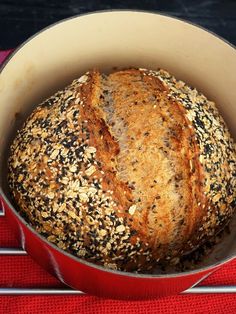 a loaf of bread in a red pot