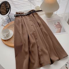 Style: commuting Size: one size Color: coffee, apricot, khaki, black, blue Casual Brown Solid Color Skirt, Brown Solid Color Skirt For Fall, High Waist Solid Beige Skirt, Beige Solid Color Skirt For Fall, Fall Midi Skirt In Solid Color, Solid Color Midi Skirt For Fall, Chic Solid Color Midi Skirt, Chic Midi Skirt In Solid Color, Chic Fall Pleated Skirt In Solid Color