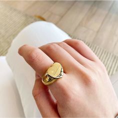 This gold heart signet ring is made from stainless steel plated in 18 karat gold. It is a unique statement piece yet simple enough to suit both casual and formal wear. This ring will add a chic and morden touch to your outfit and perfect for everyday wear.………………………………….D E T A I L S• Materials: Stainless steel, 18k gold plating.• Available Size: US 6 (Diameter: 16.5mm), US 7 (Diameter: 17.3mm), US8 (Diameter: 18.2mm)• This product is hypoallergenic, water and tarnish resistant. Trendy Gold Stainless Steel Rings, Trendy Gold Open Initial Ring, Trendy Gold Initial Open Ring, Trendy Gold Open Ring With Initial, Classic Gold Heart Ring For Everyday, Minimalist Metal Signet Ring As A Gift, Trendy Gold Initial Ring For Anniversary, Trendy Gold Signet Ring Gift, Minimalist Gold Heart Promise Ring