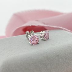 Beautiful Pink Stud Earrings. These 6mm Cubic Zirconia have the brilliance of diamonds and sparkle even more! Simple earrings that make a big impact. A romantic pink color perfect for Spring or date night.D E T A I L S 6mm Round Cubic Zirconia Butterfly Push Back Closure Sterling Silver 11mm Post 4 Prong Setting Elegant Pink Diamond Cut Earrings, Pink Diamond Earrings Gift, Pink Diamond Earrings As Gift, Pink Diamond Earrings For A Gift, Pink Brilliant Cut Diamond Earrings, Valentine's Day Round Cut Prong Set Earrings, Pink Brilliant Cut Earrings In Fine Jewelry Style, Dazzling Pink Round Earrings, Classic Pink Sterling Silver Earrings