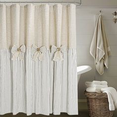 a bathroom with a shower curtain and towels