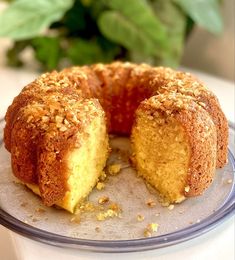 a bundt cake on a plate with one piece cut out