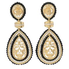 Make a beautiful statement on your lobes with these Gaetano "Persia" drop earrings. Crafted in 18K yellow gold plated sterling silver, each features an ornate filigree design on the bottom embellishment. Surrounding the cutout design are halos of black onyx gemstones, simulated diamonds and more black onyx. You'll love the complementary colors and dazzling sparkle. There's also black onyx and simulated diamonds on the top embellishments. The pair will instantly elevate any of your favorite looks Luxury Pierced Chandelier Earrings For Formal Events, Luxury Earrings With Intricate Design, Luxury Pierced Earrings For Party, Exquisite Filigree Earrings For Formal Occasions, Luxury Yellow Gold Chandelier Earrings For Party, Luxury Teardrop Earrings For Evening, Formal Black Diamond Earrings Fine Jewelry, Elegant Black Diamond Earrings, Elegant Black Diamond Earrings For Formal Occasions