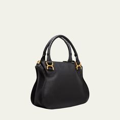 Chloe "Marcie" satchel bag in calf leather Rolled top handles, 5.5"/ 14cm drop Detachable, adjustable crossbody strap, Min: 5.5"/14cm - Max: 40.2"/ 102cm drop Zip top closure  Exterior, front flap with leather tassels Interior, one zip pocket Lining: linen Approx. 11.1"H x 14.2"W x 4.8"D item weighs approx. 1.8 lb./ 0.8 kg Professional cleaning recommended Made in Italy Classic Calf Leather Shoulder Bag With Handles, High-end Handheld Satchel With Gold-tone Hardware, High-end Satchel With Detachable Strap And Round Handle, High-end Calf Leather Satchel With Gold-tone Hardware, Calf Leather Satchel With Round Handle, Calf Leather Satchel With Detachable Strap And Round Handle, Handheld Leather Satchel With Branded Hardware, Calf Leather Satchel With Branded Hardware, Top Handle Calf Leather Satchel With Branded Hardware