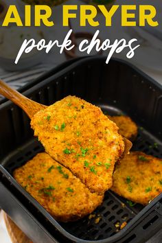 air fryer pork chops with parsley on top in a black container and text overlay that says air fryer pork chops