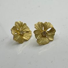 Inspired by the exquisite beauty of peony flowers, these studs exude elegance and sophistication. Crafted with meticulous detail and finished in radiant gold, they add a touch of floral glamour to any ensemble. Perfect for elevating your style with a timeless floral accent, these studs are sure to become a cherished addition to your collection. GV Peony w/CZ Luxury Flower Earrings For Formal Occasions, Formal Rose Gold Flower Earrings, Luxury Gold Flower Earrings For Anniversary, Gold Flower Earrings For Formal Events, Formal Yellow Gold Flower Earrings, Luxury Yellow Gold Flower Earrings, Gold Luxury Flower Earrings For Formal Occasions, Yellow Gold Diamond Flower Earrings, Luxury Gold Flower Earrings For Wedding