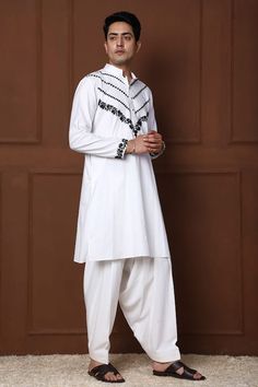 White kurta with thread embroidered floral jaal and geometric patterns. Comes with a pathani. - Aza Fashions Traditional White Salwar Kameez With Dabka Detailing, Cotton Salwar Kameez With Naqshi For Festivals, Festival Cotton Salwar Kameez With Naqshi, Traditional Naqshi Salwar Kameez For Navratri, Traditional Cotton Lawn Suit With Naqshi Details, Traditional Cotton Lawn Suit With Naqshi, Traditional Cambric Kurta With Naqshi Detailing, Traditional Straight Kurta In Cambric, White Cotton Lawn Suit With Naqshi