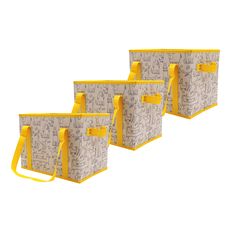 three bags with yellow handles are lined up against each other and have drawings on them