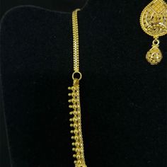 Purity Info will be here 22K Yellow Gold Weight 42.58 Gm Dimension: Necklace: 16in L Product detail: Product Code: NEAR-1301142 Color: Yellow Gold Product Type: Necklace and Earring Set Age Group: Adult Gender: Female Availability: In Stock Country Of Origin: India Product description: 22k gold necklace and earring set. Necklace measures 16 inches in length. Screwback filigree earrings measure 44mm in length. Central pendant measures 62mm from top to bottom. Necklace and earrings feature many tr 22k Yellow Gold Filigree Bridal Necklace, Yellow Gold Plated Filigree Jewelry Sets, Gold-plated Yellow Necklaces With Intricate Design, Traditional Yellow Gold Filigree Danglers, 22k Gold Filigree Yellow Necklaces, 22k Gold Necklace, Filigree Earrings, Gold Filigree, Mala Necklace