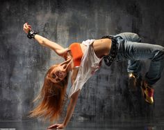 a woman doing a handstand in the rain