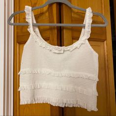 Cami Tank. Scoopneck. White. Nwt White Trendy Tops With Ruffled Straps, Casual Ruffle Crop Top For Vacation, Casual White Tops With Ruffled Straps, Casual Ruffled Crop Top For Vacation, Scoop Neck Ruffled Tops For Spring, Spring Ruffled Scoop Neck Top, White Trendy Top With Ruffled Straps, Casual Crop Top With Ruffled Straps For Spring, Casual White Tank Top With Ruffled Straps