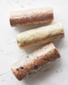 three pieces of bread sitting on top of a white counter