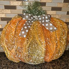 a decorative pumpkin sitting on top of a counter