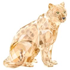 a glass figurine of a leopard on a white background