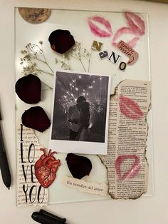 an altered photograph is displayed on top of a piece of paper with lipstick and flowers