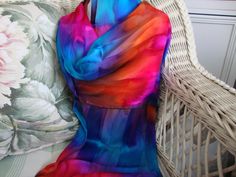 "This gorgeous multi colored streaked scarf is hand painted and is 100% silk. Hand hemmed as well. Blue violet, orange, hot fuchsia, and turquoise all intertwine to create a lovely combination of colors that will add rich jewel tones to your Spring and Summer. Ready to celebrate Festival!! Lovely mixture of colors dripping into each other to create a lovely picture for you to wear with your favorite outfit. This scarf is 11\" x 58\"-60\" (27.940 cm x 147.32cm-152.40 cm) and should be dry cleaned Bohemian Hand-dyed Multicolor Silk Scarf, Multicolor Hand Dyed Silk Scarves, Scarf Silk, Blue Violet, Summer Ready, Jewel Tones, Silk Scarves, Silk Scarf, Multi Colored