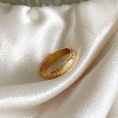 14k gold filled - handcrafted - waterproof - tarnish proof - hypoallergenic. Beautiful 14k gold filled floral band ring that is perfect for everyday wear. This gold flower band can even be worn as a wedding band. Made of 14k gold filled very thick and sturdy metal.