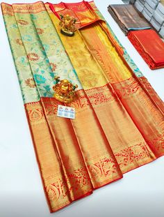 "The saree is made of pure silk kanjeevaram/kanchipattu with gold zari, Pallu, and blouse. Various Colours Available, please see photos. Mention desired colour in \"Optional Note\" when purchasing saree. ❗️❗️❗️PLEASE CONTACT SELLER TO CONFIRM COLOUR COMBINATION FOR AVAILABILITY ️❗️❗️ Upon request: Tussels, fall and pico and blouse work (Aari work and Maggam work) will be done with extra charges  Excellent quality with beautiful colours and combinations." Multicolor Paithani Silk Saree With Tilla, Multicolor Paithani Silk Saree With Tilla Details, Gold Saree With Tilla For Navratri, Multicolor Tilla Saree For Diwali, Ceremonial Gold Tussar Silk Traditional Wear, Gold Meenakari Tissue Silk Saree, Gold Art Silk Dupatta With Tilla, Gold Tilla Saree For Festivals, Gold Meenakari Saree For Festivals