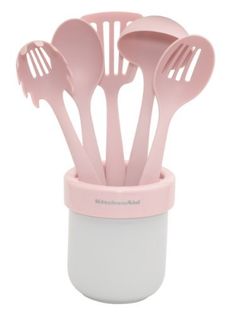 pink utensils in a cup with spoons on the top and bottom part