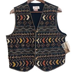 This vintage Rafaella deadstock new with tags vest is in excellent condition! A 90s waistcoat style vest with an allover beadwork design. Eclectic boho aztec vibe with wooden beads, metallic beads in a southwest style print. Black 100% silk with brown tan green and red beading. Comes with an extra bag of beads! Size medium See pics for measurements. Bohemian Fall Vest Outerwear, Bohemian Vest Outerwear For Fall, Winter Bohemian Black Vest, 90s Waistcoat, Waistcoat Style, Tan Silk, Southwest Boho, Eclectic Boho, Grandma Fashion