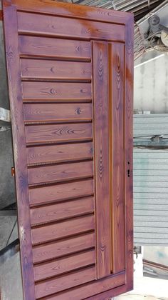 a close up of a wooden door with slats on it