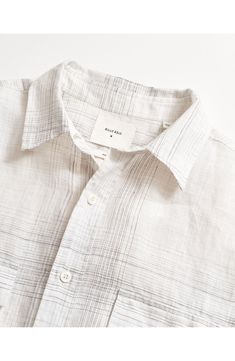 Softly slubbed linen woven in a yarn-dyed plaid furthers the relaxed, easy-wearing appeal of a shirt that's perfect for leaving untucked on sunny days. 28 1/2" length; 45" chest Front button closure Spread collar Long sleeves with button cuffs Chest button-flap patch pockets 100% linen Machine wash, tumble dry Imported Mens Woven Shirts, Work Fits, Billy Reid, Linen Men, Casual Luxury, Henley Sweater, Men Stylish Dress, Linen Shirt Men, Linen Yarn